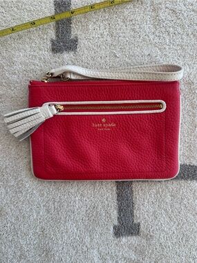 kate spade Red Pebbled Leather Wristlet with Ivory Tassel